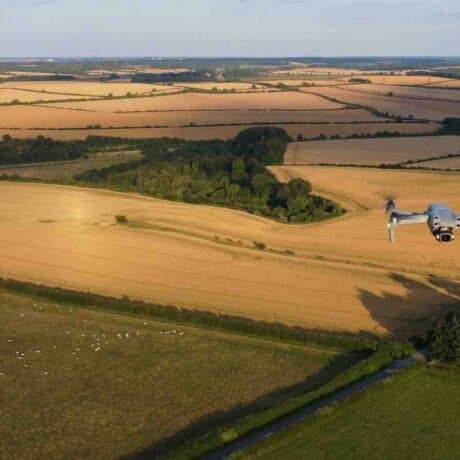 Image of british farmland with a drone flying above fields