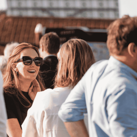 Image of women laughing and having a conversation